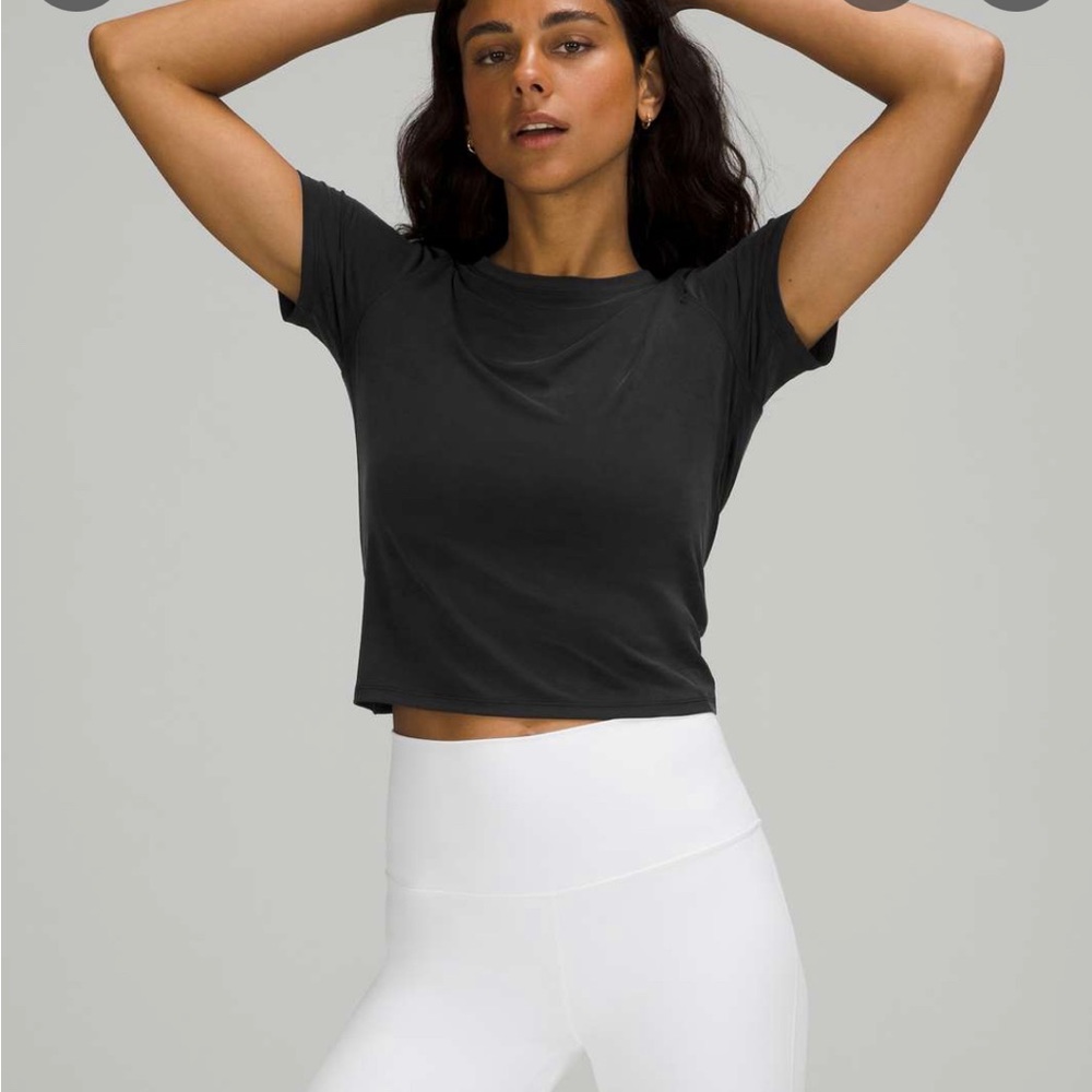Brand new with tags, grey size 4 LULULEMON tie back short sleeve shirt.
